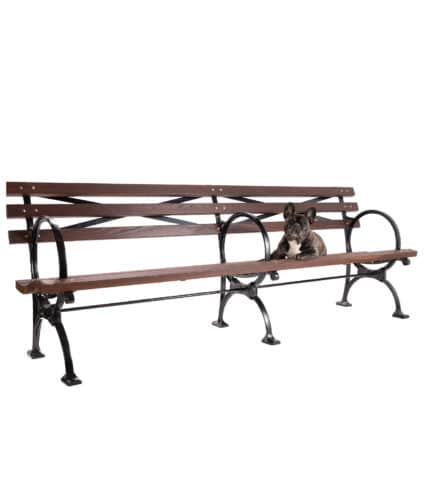 A studio image of the R-5514 World's Fair Bench taken with a dog relaxing on the seating area