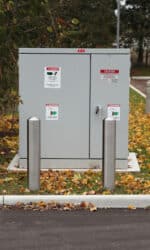 R-7301-EX stainless steel bollard in front of utility box