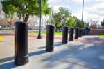Row of R-7535 decorative bollards in sunny environment