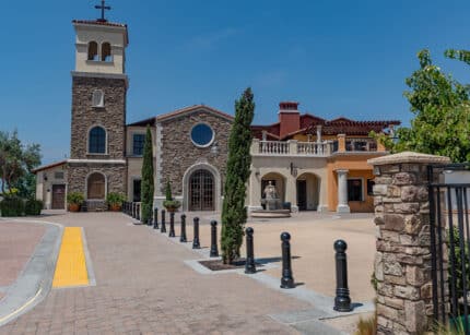 Line of Three R-7551 decorative bollards in front of building