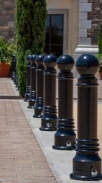 Line of Three R-7551 decorative bollards in concrete