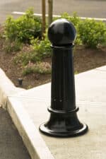 Single R-7582 decorative bollard on street corner