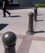 Row of R-7582 decorative bollards on pedestrian walkway