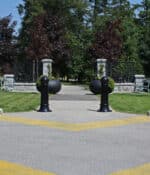 R-7582 decorative bollards on outdoor path near entranceway