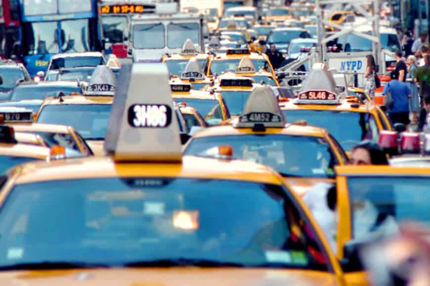 Congested street with taxis and other vehicles