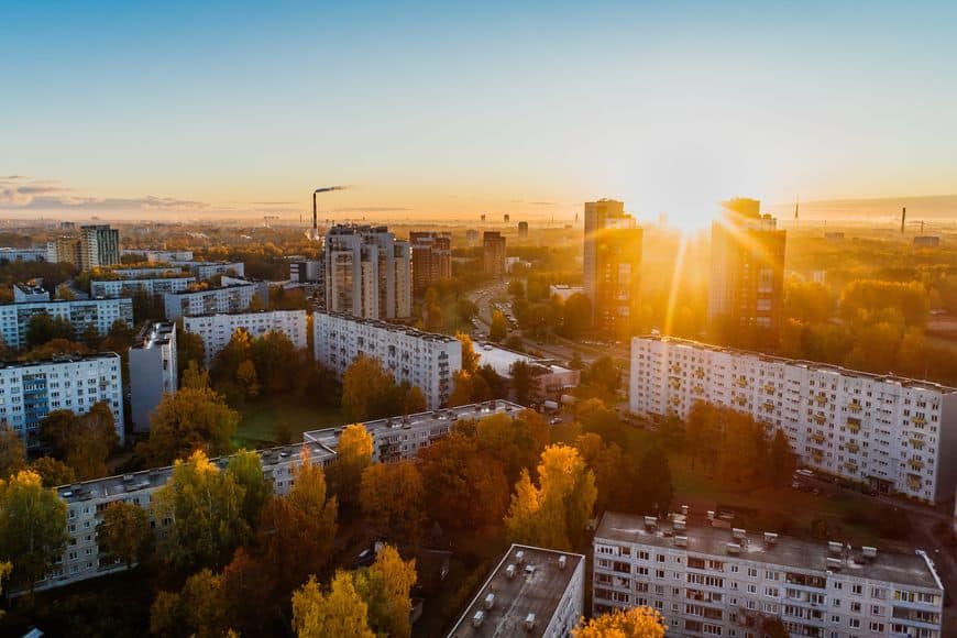 Aerial shot of a green city during golden hour